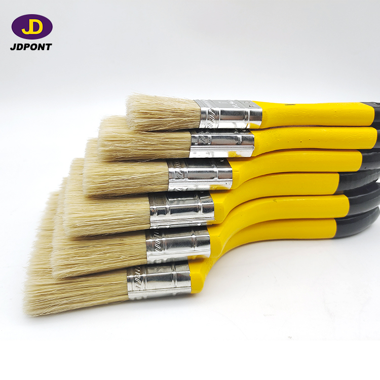 Yellow wooden handle bristle mixture filament paintbrush for most of the paint